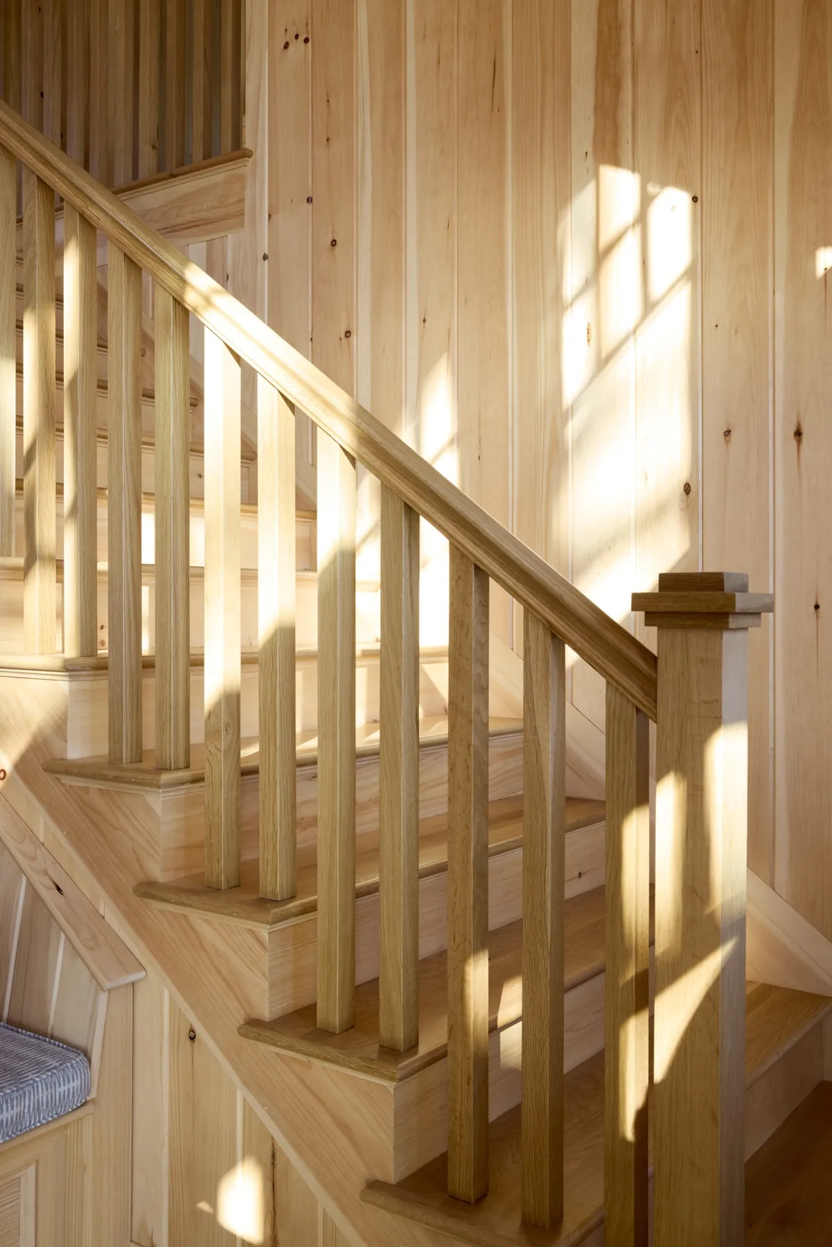 Custom wood staircase and millwork by Hobart Contracting