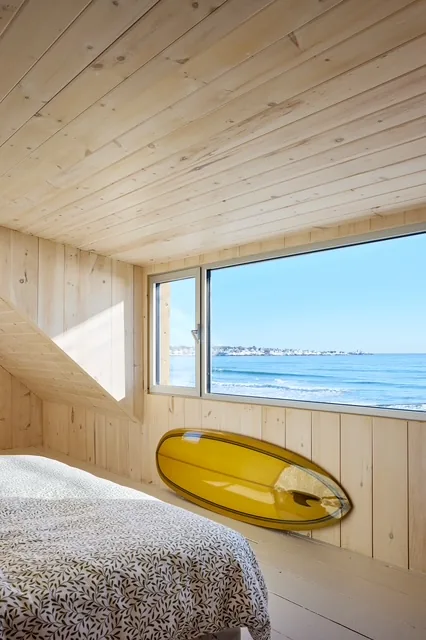 York Beach bedroom with yellow surfboard and ocean view